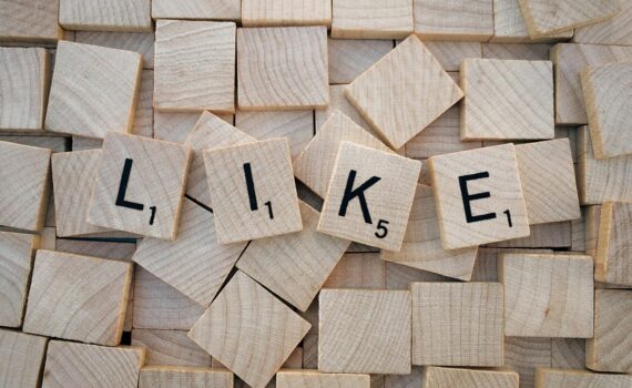 like printed on brown wooden scrabble